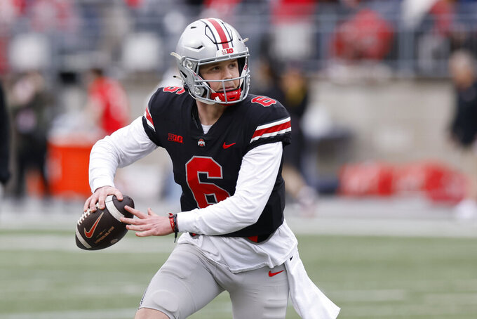 FILE - Ohio State quarterback Kyle McCord plays in an NCAA college spring football game Saturday, April 16, 2022, in Columbus, Ohio. Two-year starter C.J. Stroud is off to the NFL in the draft next month, which means Ohio State coach Ryan Day needs to find a new quarterback for 2023. The race pits third-year backup Kyle McCord, who has seen limited action in his first two seasons, against second-year player Devin Brown. (AP Photo/Jay LaPrete, File)