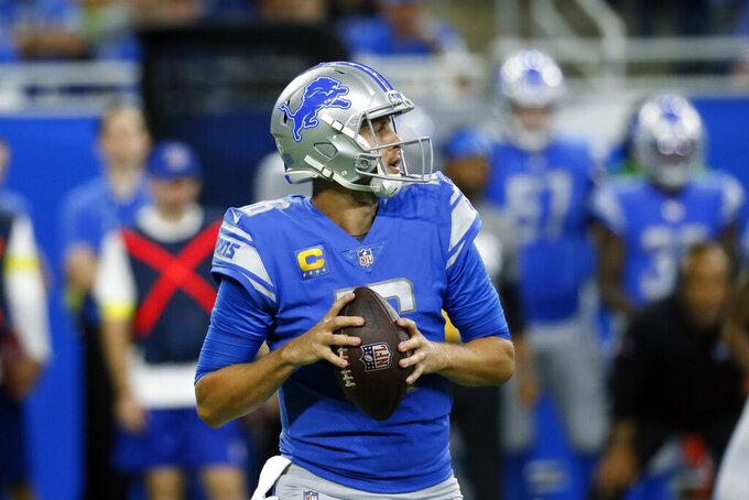 Detroit Lions quarterback Jared Goff looks downfield during the first half of an NFL football game against the Seattle Seahawks, Sunday, Oct. 2, 2022, in Detroit. (AP Photo/Duane Burleson)