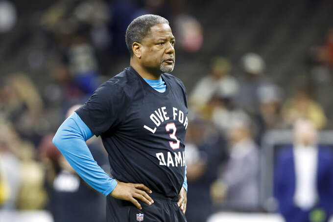 FILE - Carolina Panthers' Steve Wilks warms up wearing a T-shirt in support of Buffalo Bills player Damar Hamlin before an NFL football game between the Panthers and the New Orleans Saints in New Orleans, Sunday, Jan. 8, 2023. Former Carolina Panthers interim head coach Steve Wilks Tweeted “disappointed, but not defeated” that he didn’t landed the team’s full-time head coaching position. The Panthers announced on Thursday, Jan. 26 they've agreed to hire Frank Reich as their new head coach.(AP Photo/Butch Dill, File)