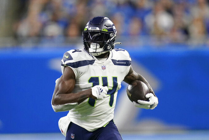 Seattle Seahawks wide receiver DK Metcalf runs during the first half of an NFL football game against the Detroit Lions, Sunday, Oct. 2, 2022, in Detroit. (AP Photo/Paul Sancya)