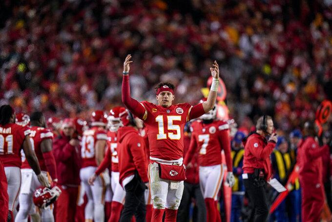 Kansas City Chiefs quarterback Patrick Mahomes (15) cheers during the second half of an NFL divisional round playoff football game against the Jacksonville Jaguars, Saturday, Jan. 21, 2023, in Kansas City, Mo. The Kansas City Chiefs won 27-20.(AP Photo/Jeff Roberson)
