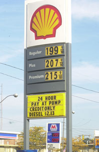 The Marathon sign is seen through the Shell sign on South Main Street in Celina this morning. Gas prices have been hovering around $2 a gallon recently.<br>dailystandard.com