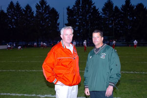 Wapakoneta head coach Kevin Fell, left, and Celina head coach Mike Fell talk before Friday's game at Celina Stadium. Big brother Kevin's Redskins defeated Mike's Bulldogs, 20-7.<br>dailystandard.com