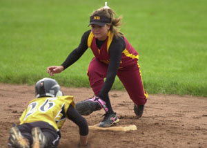 New Bremen shortstop Morgan Cox, right, waits to put the tag on Parkway's Jayme Marbaugh, 26, for an out when Marbaugh tried to stretch a single into a double during the third inning of Monday's Midwest Athletic Conference matchup at Mendon. Parkway stayed unbeaten in the MAC with a 2-0 victory over the Cardinals.<br></br>dailystandard.com