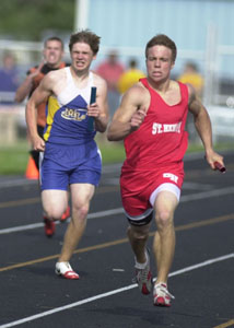 St. Henry's Ryan Huwer, right, edges out Marion's Dillon Kremer down the stretch in the 800-meter relay. Huwer also won the 100 and 200-meter dashes.<br></br>dailystandard.com