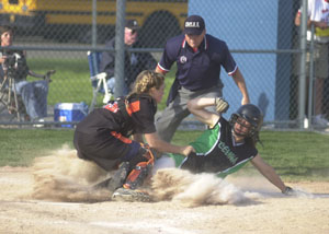 Celina's Allison Braun, right, is out at the plate as Elida catcher Kylee Prince, left, tags her out during their Division II sectional contest at Lima Bath High School. Celina was eliminated from postseason play by Elida, 7-6.<br></br>dailystandard.com
