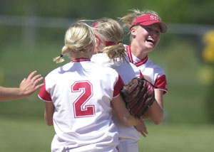 St. Henry softball players celebrate after the Redskins defeated Allen East 4-2 in Saturday's Division IV district final at Wapakoneta. St. Henry will play West Liberty-Salem on Thursday at Huber Heights in the regional semifinals.<br></br>dailystandard.com