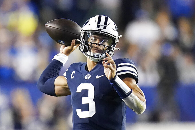 BYU quarterback Jaren Hall throw a pass against Wyoming during the first half of an NCAA college football game Saturday, Sept. 24, 2022, in Provo, Utah. (AP Photo/Rick Bowmer)