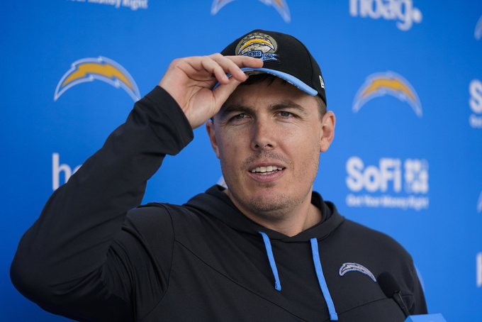 Los Angeles Chargers offensive coordinator Kellen Moore talks to reporters after the NFL football team's camp Wednesday, May 31, 2023, in Costa Mesa, Calif. (AP Photo/Jae C. Hong)