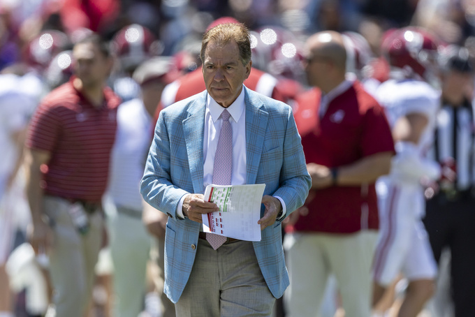 FILE - Alabama head coach Nick Saban paces as his team warms up before Alabama's A-Day NCAA college football scrimmage, Saturday, April 22, 2023, in Tuscaloosa, Ala. Saban says college football is not a business that operates like the NFL and warned that without more uniform rules on player compensation only the biggest spenders will compete for championships. (AP Photo/Vasha Hunt, File)