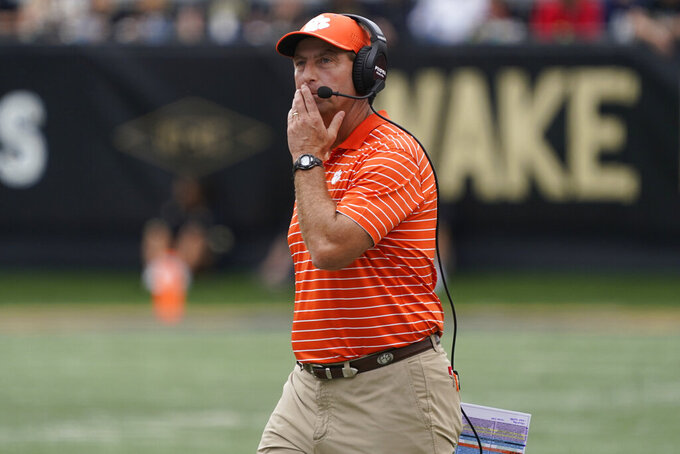 Clemson head coach Dabo Swinney watches a video replay during the second half of an NCAA college football game against Wake Forest in Winston-Salem, N.C., Saturday, Sept. 24, 2022. (AP Photo/Chuck Burton)