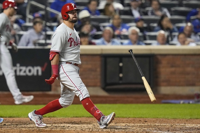 Philadelphia Phillies' Kyle Schwarber tosses his bat after striking out during the eighth inning of the team's baseball game against the New York Mets on Wednesday, May 31, 2023, in New York. (AP Photo/Frank Franklin II)