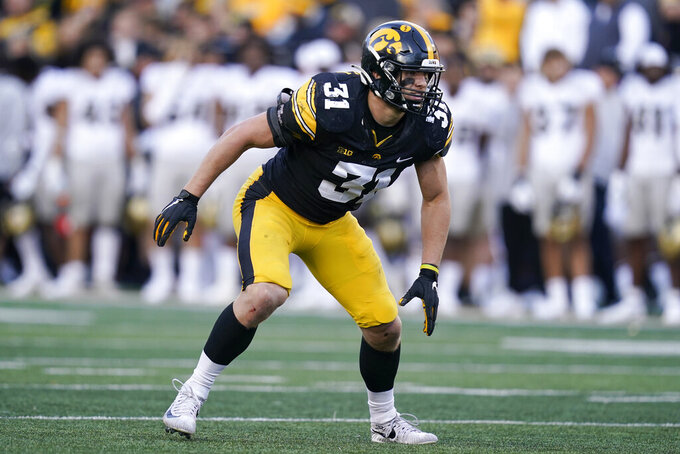 FILE - Iowa linebacker Jack Campbell (31) runs on the field during the second half of an NCAA college football game against Purdue, Saturday, Oct. 16, 2021, in Iowa City, Iowa. Campbell plans to savor his 2023 senior football season after missing spring practice to allow nagging injuries to heal. Campbell was the national leader in tackles with 143 last season and a second-team pick to The Associated Press All-Big Ten team. (AP Photo/Charlie Neibergall, File)