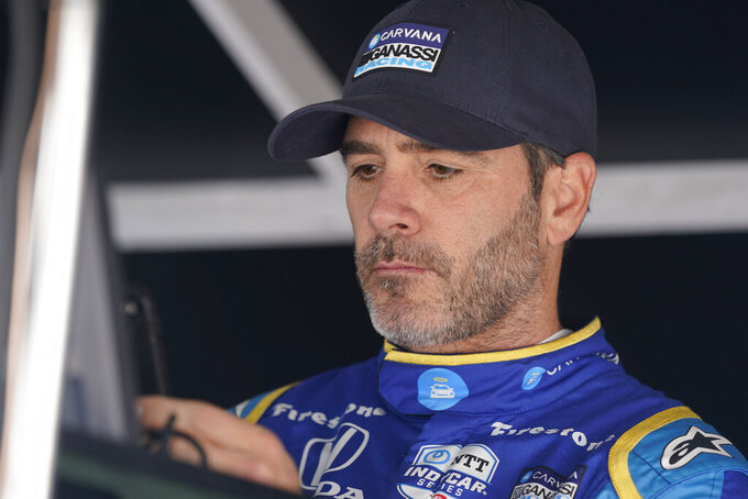 Jimmie Johnson sits in his pit box before the final practice for the Indianapolis 500 auto race at Indianapolis Motor Speedway, Friday, May 27, 2022, in Indianapolis. (AP Photo/Darron Cummings)
