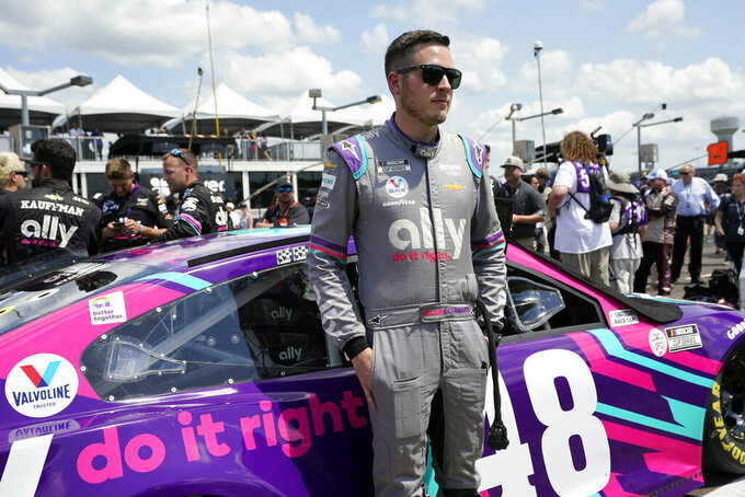 FILE - Alex Bowman waits for the start of a NASCAR Cup Series auto race on June 20, 2021, in Lebanon, Tenn. Bowman felt he underperformed last year when NASCAR brought the Cup Series back to the Nashville area for the first time in 37 years.  He's now seeking a stronger showing Sunday, June 26, 2022. (AP Photo/Mark Humphrey, File)
